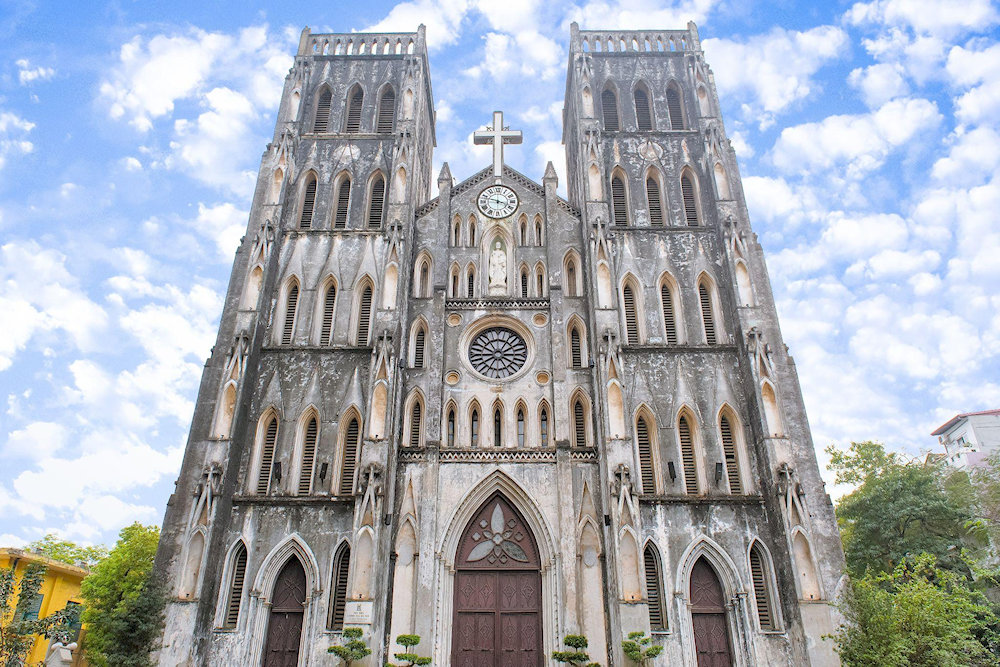 Admire the neo-Gothic elegance of St. Joseph Cathedral, a striking symbol of Hanoi’s French colonial legacy 